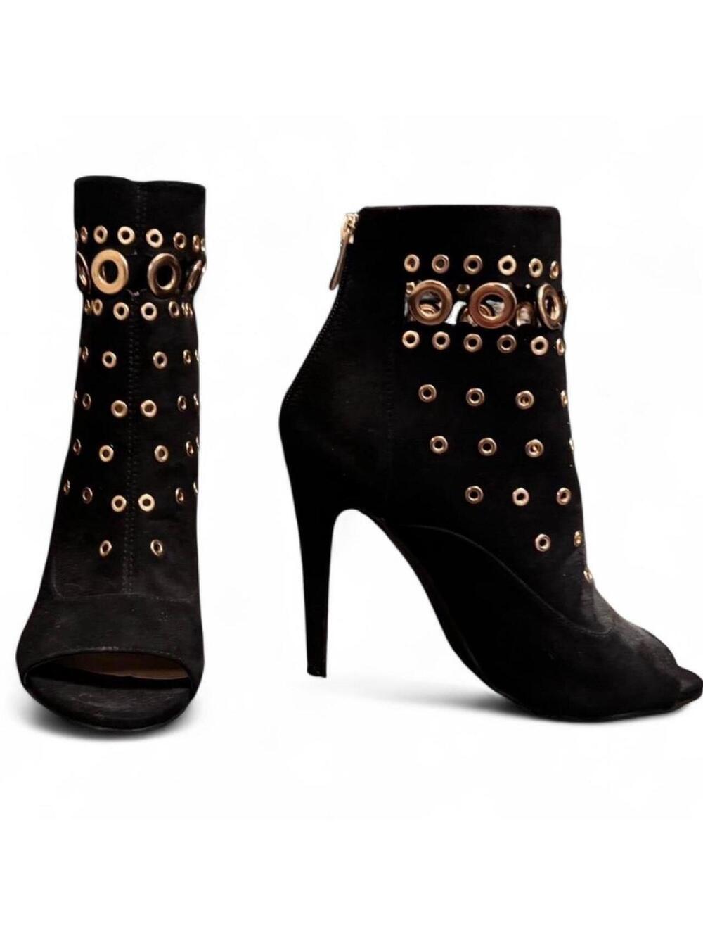 Black stiletto ankle boots with gold circular cut outs